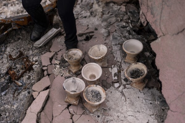 The Renata Ortega float is passed by the ceramics on which it saved it after the Eaton fire, in Altadena, California, Saturday, March 29, 2025. (AP Photo/Jae C. Hong)